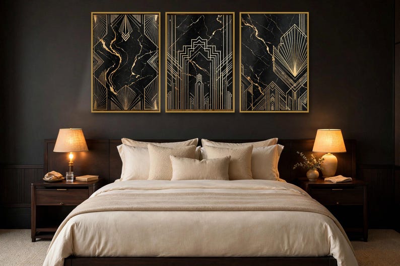 May include: A set of three rectangular wall art prints featuring black marble backgrounds with gold geometric line patterns, each encased in a thin gold frame, displayed horizontally above a bed with beige bedding and two lamps.