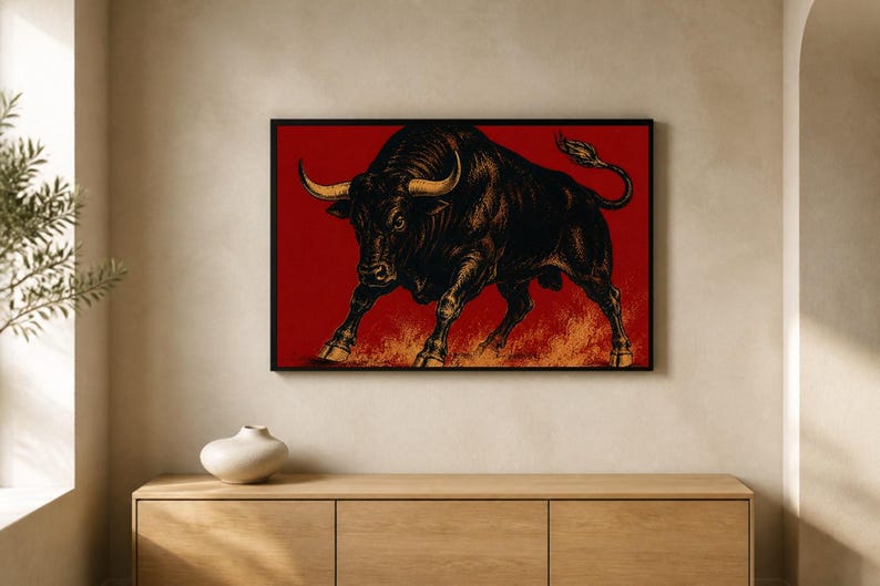 May include: A rectangular wall art print featuring a detailed black bull illustration with prominent golden horns, set against a deep red background with orange flame-like textures at the bottom, all enclosed within a thin black frame.