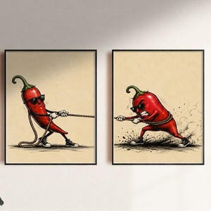 May include: Two framed wall art prints featuring a red chilli pepper character wearing sunglasses and trainers. In the left print, the chilli pulls a rope, and in the right print, the chilli pulls the same rope with an intense, angry expression.