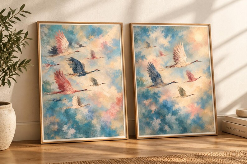 May include: Two framed wall art prints featuring a flock of birds in flight against a soft, painterly sky of blue, pink, and cream clouds. The birds are depicted in shades of white, grey, and pink, captured in various poses of movement.