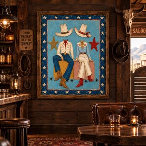 May include: A framed painting on a blue background featuring two headless figures in western attire, wearing cowboy hats, shirts, and boots, seated on blocks. The border is decorated with white stars, and a gold and red star flank the figures.