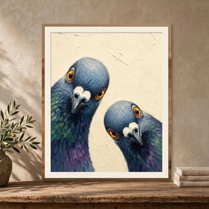 May include: A framed wall art print featuring an oil painting of two pigeons with iridescent blue, green, and purple neck feathers and bright orange eyes, set against a textured cream-colored background with visible brushstrokes.