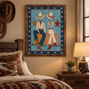 May include: A framed wall art piece featuring a painting of two figures wearing cowboy hats, shirts, and pants, sitting on blocks. The artwork has a blue border with white stars, a gold star on the left, and a red star on the right side.