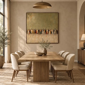May include: A large square wall art piece featuring an abstract painting of a crowd of people in muted tones of brown, blue, and orange against a textured sage green background, framed in a thin dark wood border and displayed above a dining table.