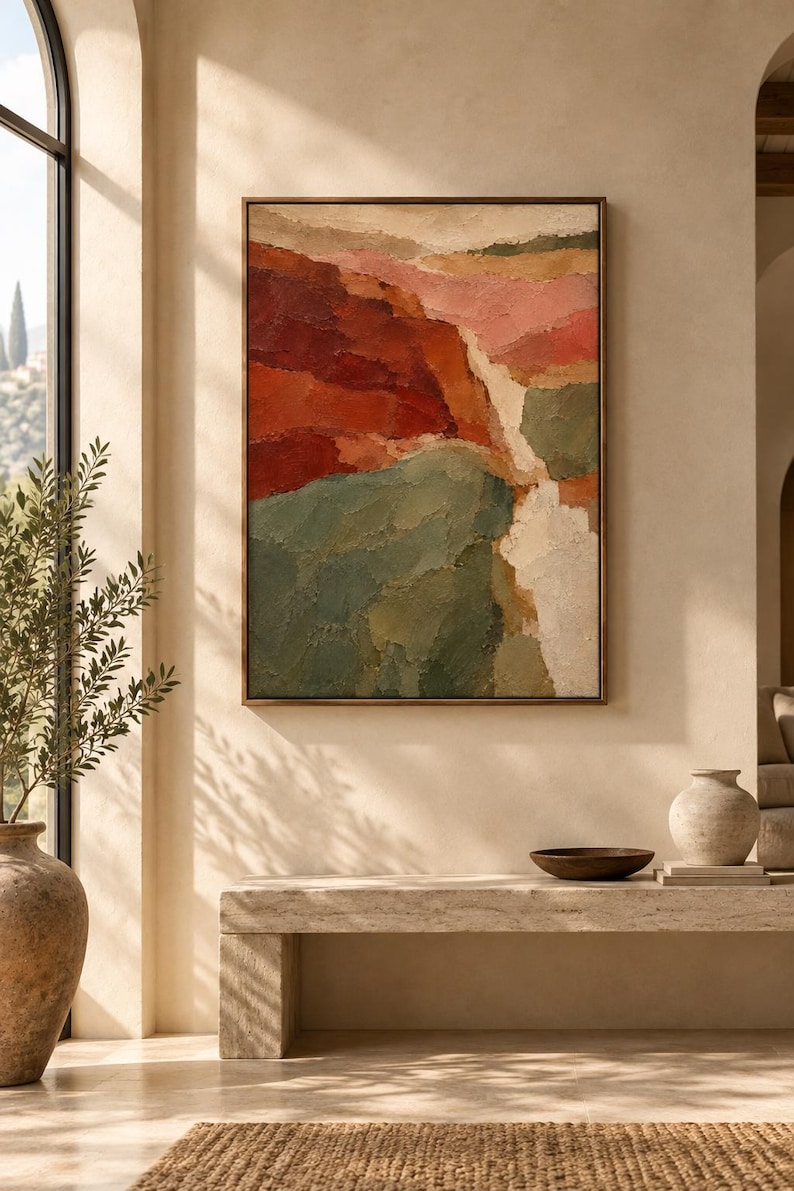 May include: A rectangular wall art piece featuring an abstract landscape painting with thick, textured brushstrokes in shades of deep red, muted green, soft pink, and cream, enclosed within a thin, dark brown wooden frame hanging on a wall.