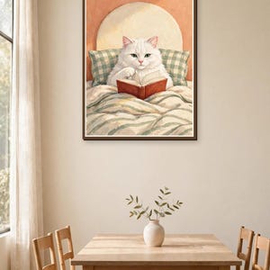 White cat reading book art print in a dining room — whimsical bookish wall art for cat lovers