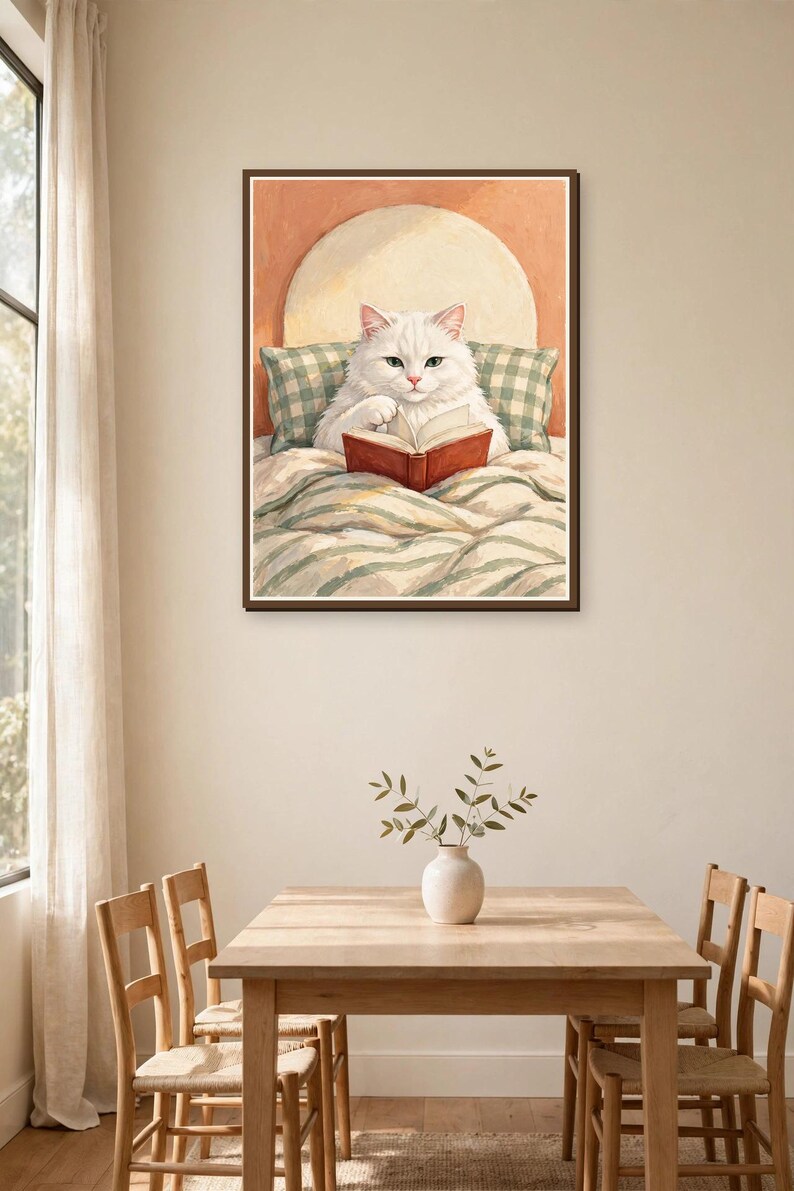 White cat reading book art print in a dining room — whimsical bookish wall art for cat lovers