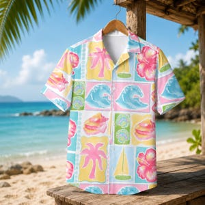 May include: A short-sleeved button-down shirt featuring a colourful tropical print. The pattern includes pink palm trees, yellow sailboats, blue ocean waves, pink hibiscus flowers, and seashells arranged in a grid of yellow, blue, and pink squares.