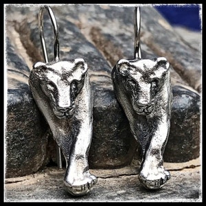 Lioness silver earrings. Silver lioness earrings front view. Lioness silver earrings seen from the face. image 1
