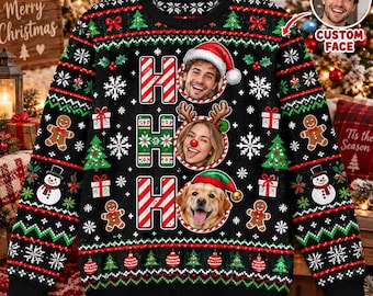 May include: A black long-sleeve sweater featuring a repeating Christmas pattern of gingerbread men, snowmen, and snowflakes. The center displays the text HO HO HO with three circular photo frames containing a man, a woman, and a golden retriever.