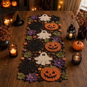 May include: A rectangular crochet table runner featuring a repeating pattern of white ghosts, orange jack-o'-lanterns, black spiderwebs, purple flowers, and green leaves. The intricate lace-like design is crafted with black yarn connecting the motifs.