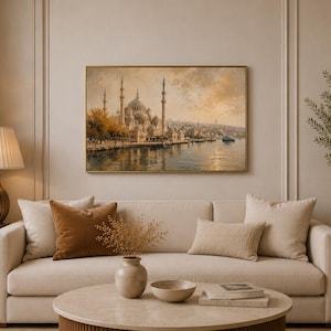 May include: A rectangular wall art print featuring an oil painting of a mosque with multiple minarets and domes situated along a waterfront at sunset. The scene includes warm golden tones, reflections on the water, and a thin gold frame.