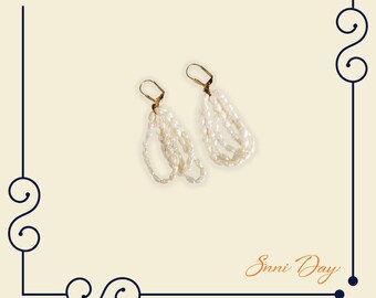 Triple Hoop White Fresh Water Pearl Earrings With Gold Tone Leverback.