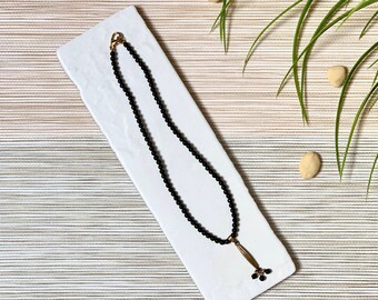 Black Onyx Beads Necklace with long gold hanging metal beads & gold Clasp