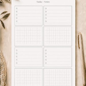 May include: A white paper planner sheet with the heading Tasks / Notes. The layout features eight rectangular sections arranged in two columns, alternating between lined areas with checkboxes and grid-patterned areas for organised daily planning.