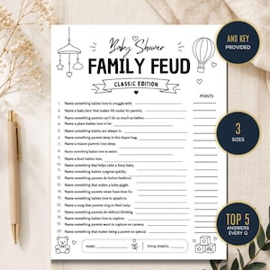 May include: A white paper Baby Shower Family Feud game sheet with black text and line drawings of a mobile, hot air balloon, and teddy bear. The sheet includes twenty numbered questions, a name field, and a total points field for participants.