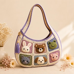 May include: A crescent-shaped crochet handbag featuring six square panels with 3D animal faces including a white rabbit, brown bear, green frog, gray cat, tan dog, and pink pig. The bag has a purple and cream border, a handle, and a purple tassel.