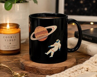 Black Saturn Astronaut Mug | Cosmic Coffee Cup, Space Explorer Design