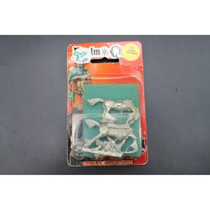 May include: A blister-packed Citadel Miniatures set containing two unpainted metal Chaos Centaur figures on a green foam insert. The red cardboard backing features the text Realm of Chaos, 7327 Chaos Centaurs, and Citadel Miniatures.
