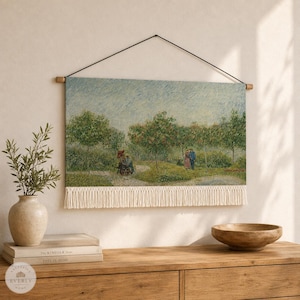 May include: A rectangular wall hanging featuring a printed landscape painting of a garden path with trees and figures. The textile piece is suspended from a wooden rod with a black cord and finished with a long, cream-colored fringe at the bottom.