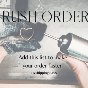 May include: A close-up of a heart-shaped gold ring being crafted. The text "RUSH ORDER" is at the top, with additional text below. A hand holds a tool, and the ring is being polished.