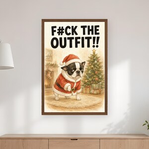 May include: A framed wall art print featuring a Boston Terrier wearing a red and white Santa Claus suit and hat. The text F#CK THE OUTFIT!! is printed at the top. The background shows a Christmas tree, wrapped gifts, and a fireplace.