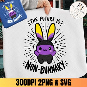 May include: A white fabric surface featuring a graphic of a cartoon rabbit with yellow, white, and purple ears. The rabbit has a black and purple body. The text "THE FUTURE IS NON-BUNNARY" is printed in black around the central rabbit illustration.