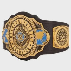 May include: A black leather championship belt featuring a large gold circular center plate with the text INTERCONTINENTAL HEAVYWEIGHT CHAMPION, a central WWE logo, and blue and gold globe accents on the side plates with a gold WWE logo.