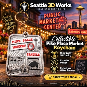 May include: A silver-toned metal keychain featuring a raised relief design of the Pike Place Market entrance in Seattle. The rectangular charm includes red text reading PIKE PLACE MARKET and SEATTLE, with a small clock and a pig silhouette.