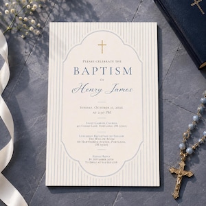 May include: A rectangular baptism invitation card with a cream background, vertical light blue stripes, and a central decorative frame. It features a gold cross icon and text detailing the event for Henry James on Sunday, October 11, 2026.