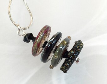 Glass necklace black green red art lampwork bead disks with black crystals