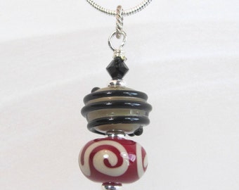 Necklace red, tan and black stacked glass lampwork beads with crystals