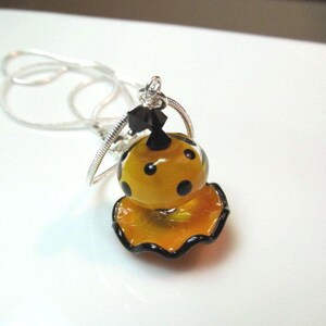 Necklace orange & black ruffle and polka dot glass lampwork beads, black crystals