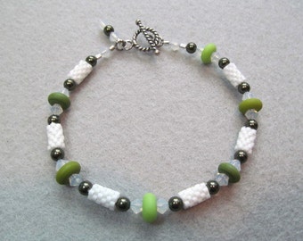 Bracelet, white beaded beads, green lampwork glass art beads, beading using peyote stitch