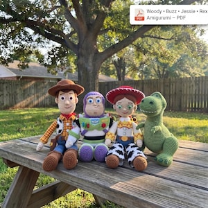 May include: Four crocheted dolls representing Woody, Buzz, Jessie, and Rex. Woody wears a brown hat, yellow shirt, and blue pants. Buzz has a purple hood and white suit. Jessie wears a red hat and cow-print chaps. Rex is a green dinosaur.