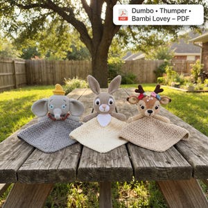 May include: Three crocheted lovey blankets featuring Dumbo, Thumper, and Bambi characters. Each toy has a stuffed head and a flat, square crocheted blanket body. The text Dumbo • Thumper • Bambi Lovey - PDF is visible in the upper right corner.