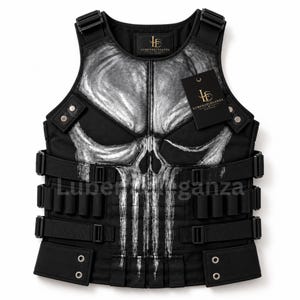 May include: A black tactical vest featuring a large, distressed white skull graphic on the front. The vest includes adjustable side straps with black buckles, metal rivets, and a black brand tag labeled LUBENAELEGANZA attached to the chest area.
