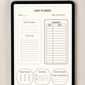 Peut inclure: Une tablette numérique affichant un modèle de planificateur quotidien avec des sections pour les priorités, une liste de tâches, un emploi du temps, un suivi d'eau, un plan de repas et une section gratitude, en texte brun sur fond crème.