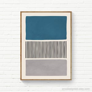 May include: Abstract geometric art print with a teal blue rectangle, black and white stripes, and a gray rectangle. The print is framed in a light wood frame.