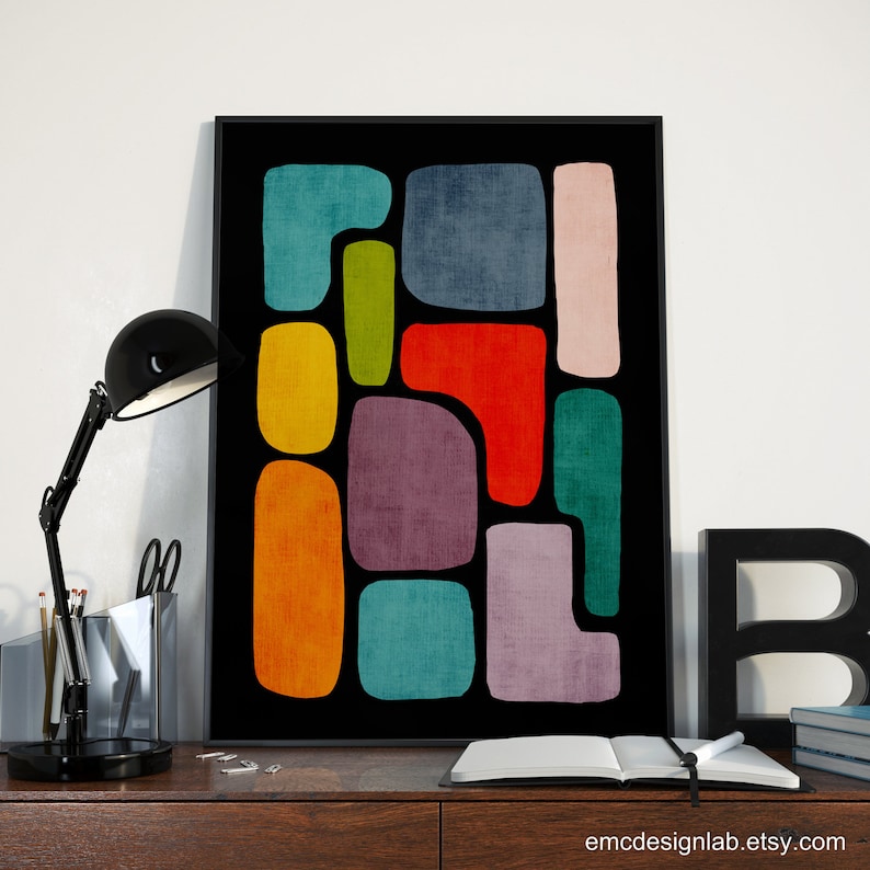 May include: Abstract art print with colorful geometric shapes on a black background. The shapes are in shades of red, orange, yellow, green, blue, and purple.