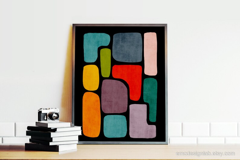 May include: Abstract art print with a black background and colorful geometric shapes in shades of red, orange, yellow, green, blue, purple, and pink.