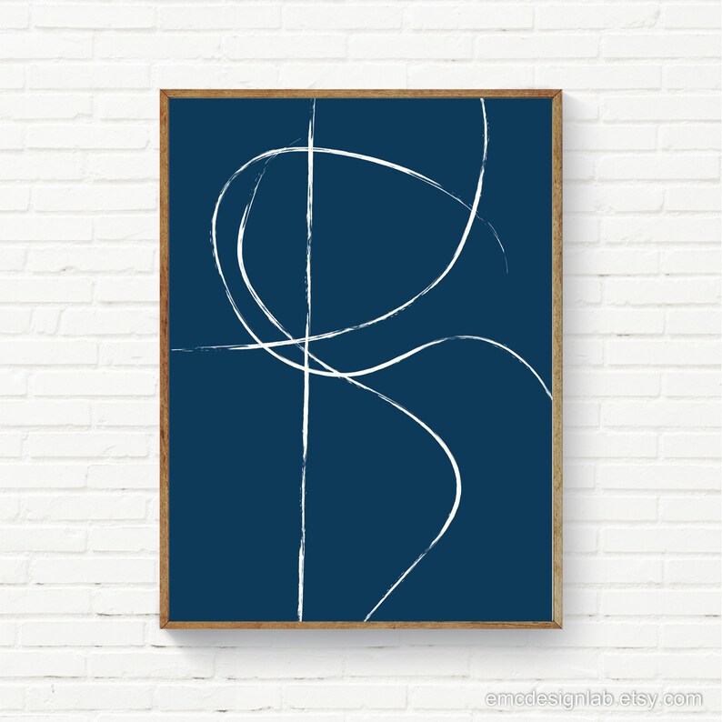 May include: Abstract art print with white lines on a dark blue background. The lines are simple and organic, creating a modern and minimalist design.