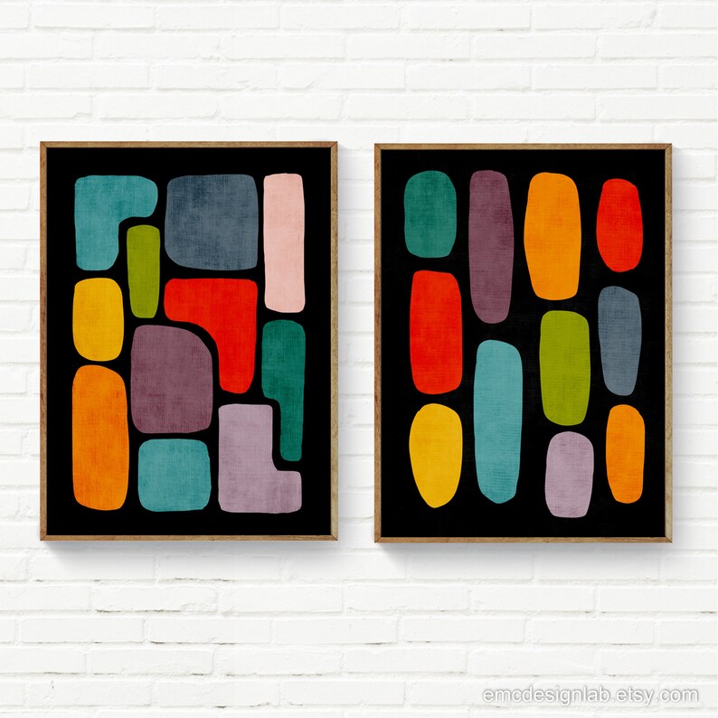 May include: Two abstract art prints with a black background and colorful geometric shapes. The shapes are in various shades of red, orange, yellow, green, blue, and purple.