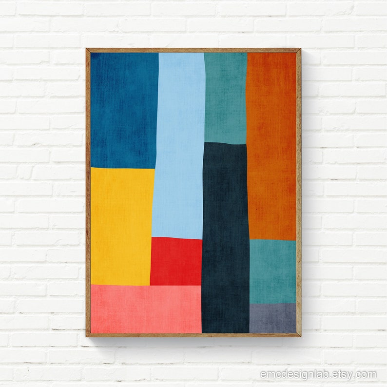 May include: Abstract geometric art print with a wooden frame. The print features a colorful design with shades of blue, yellow, red, orange, and green.