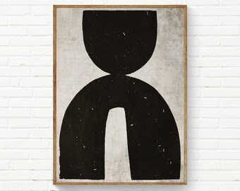 May include: Abstract art print featuring a black geometric design on a neutral background. The artwork is framed in a natural wood tone and mounted on a white brick wall. The design includes a large, rounded shape above a larger arch.