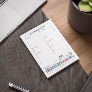May include: A white notepad titled BENCH BRAIN DUMP with sections for Quick Notes, Sketch/Diagram, Follow Up, Data to Analyse, Email Later, Need to Order, Ideas, and Questions for PI, featuring a colorful illustration of laboratory glassware.