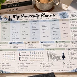 May include: A My University Planner desk pad featuring a weekly schedule, habit tracker, and goal sections. The design includes mountain and pine tree illustrations, with text headers for study, work, train, wellbeing, social, and progress.
