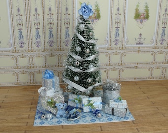 Shabby chic Dollhouse Miniature Christmas tree. Beautiful Tree decorated in blue, on carpets with gifts and details for the Xmas decoration.