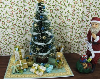 Shabby chic Dollhouse Miniature Christmas tree. Beautiful Tree decorated in gold, on carpets with gifts and details for the Xmas decoration.