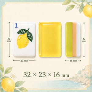 May include: Three rectangular tiles measuring 32 mm by 23 mm by 16 mm. One white tile features a blue number 1 and a yellow lemon graphic. One tile is solid yellow. One tile has vertical stripes of light green, peach, and white colors.